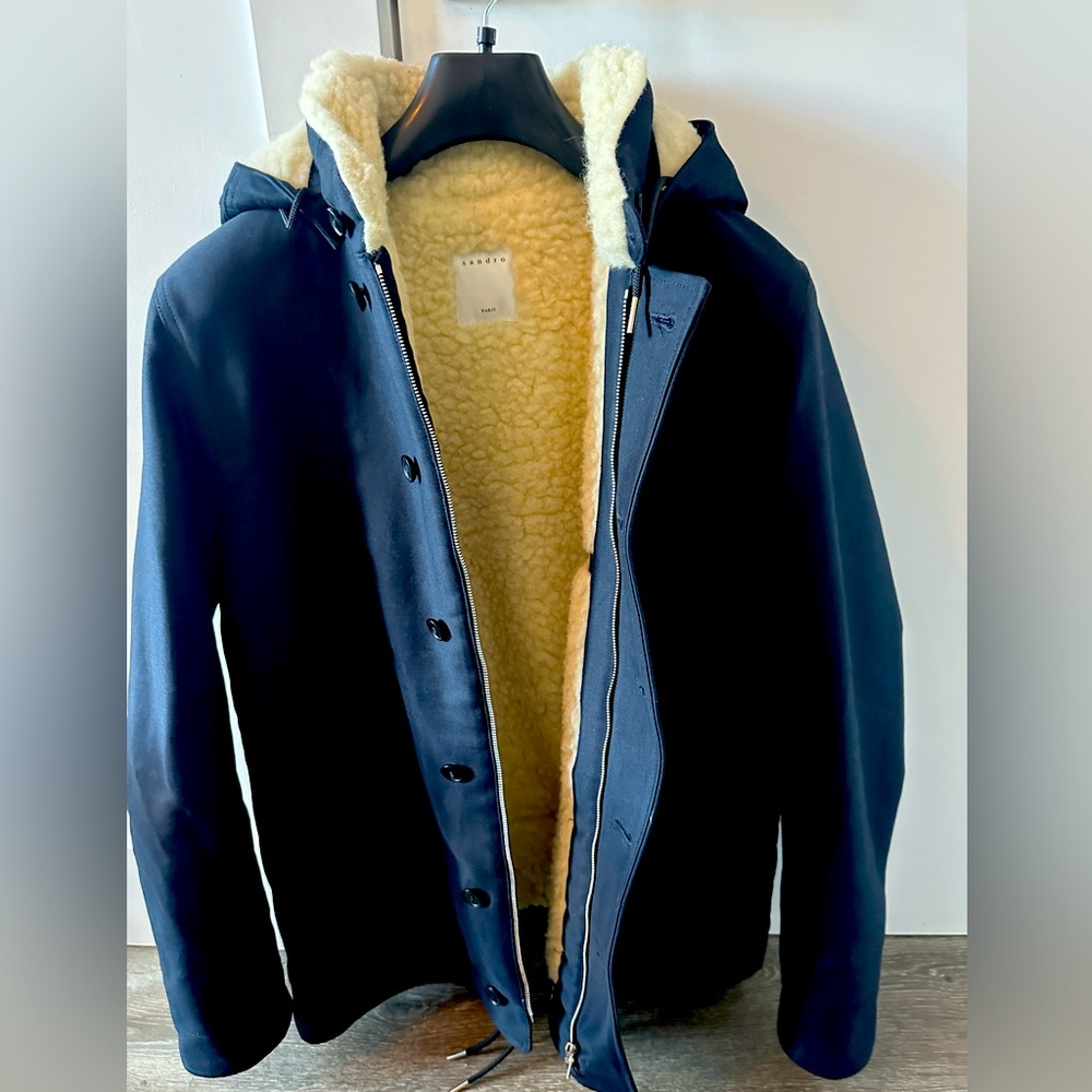 Wool coat of Sandro, used only a few times. Like new. Very warm, navy blue